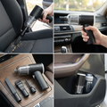 Handheld car vacuum in use cleaning a car seat