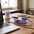 COLOUR:65W GaN EU Purple - travel power strip on a hotel desk with devices plugged in