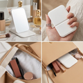 COLOUR:white - folding makeup mirror open and standing on a dressing table