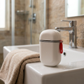 White waterproof travel soap container on a hotel bathroom basin